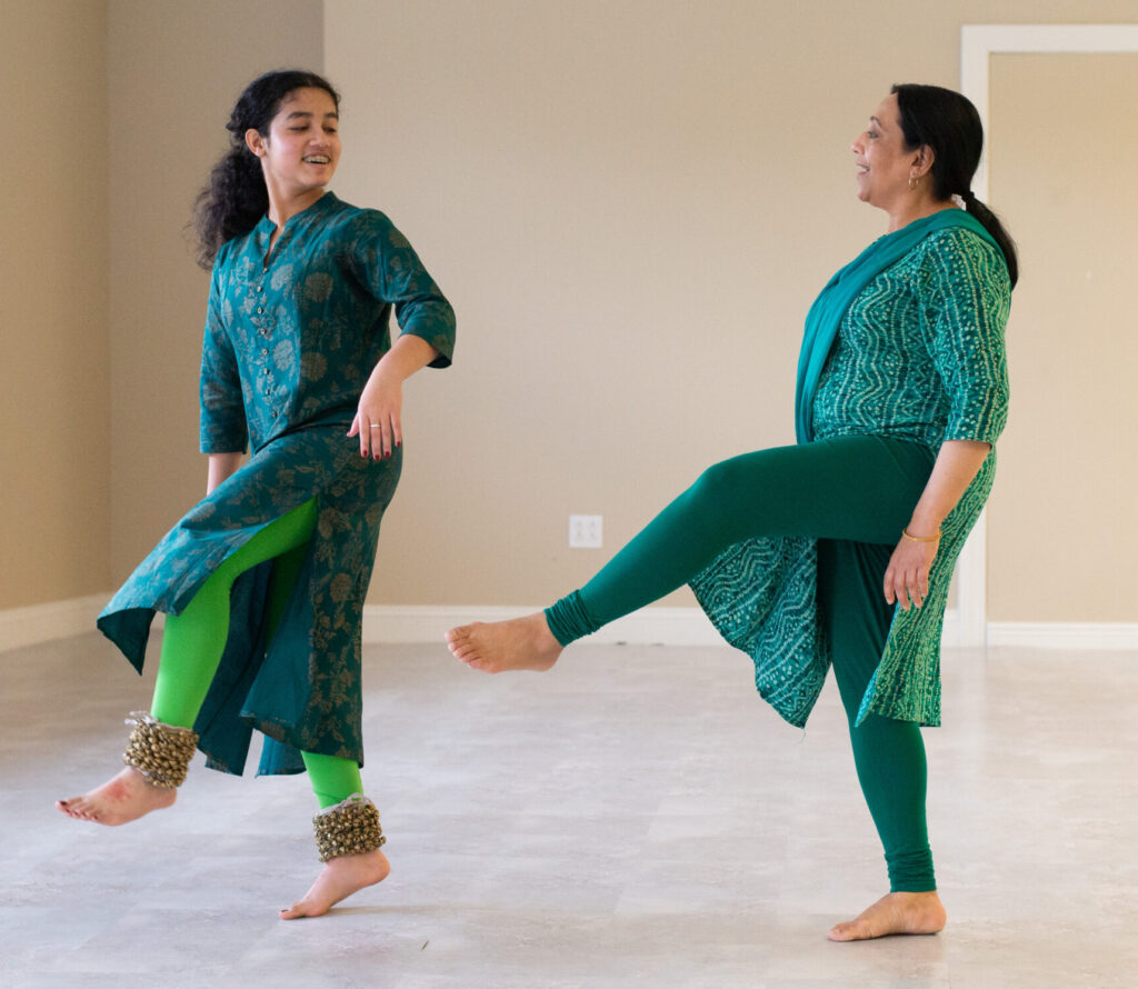 Kathak dancers in green dresses