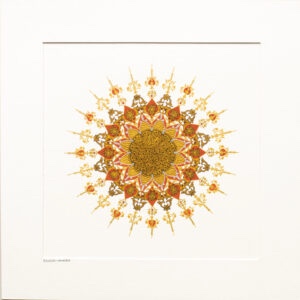 intricately detailed sunburst shape in red and gold