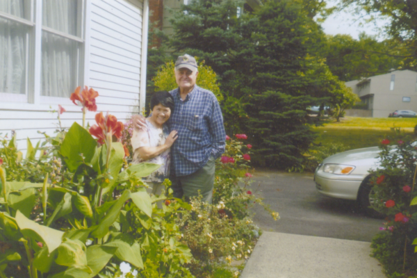 Cortland “Corky” and Yukiko “Yuki” Field stand in front of their Middletown home in 2010. Field served as a rescue helicopter pilot during the Vietnam War. Connecticut Museum Collection, gift of the Field Family, 2026.40.53.